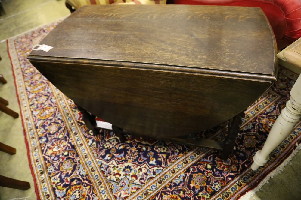 A 1920s oak twist leg gateleg table, width 102cm, depth 54cm, height 72cm